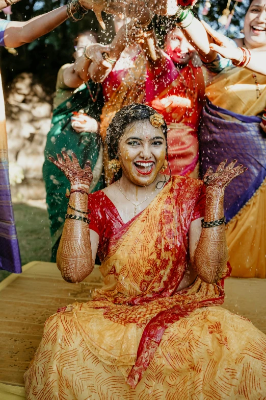 some women holding items in their hands to perform on the stage