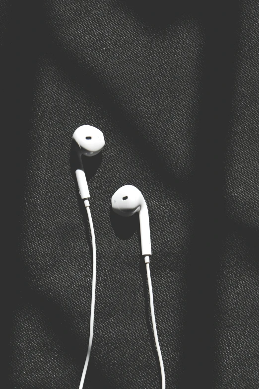 a pair of ear phones sitting on top of each other