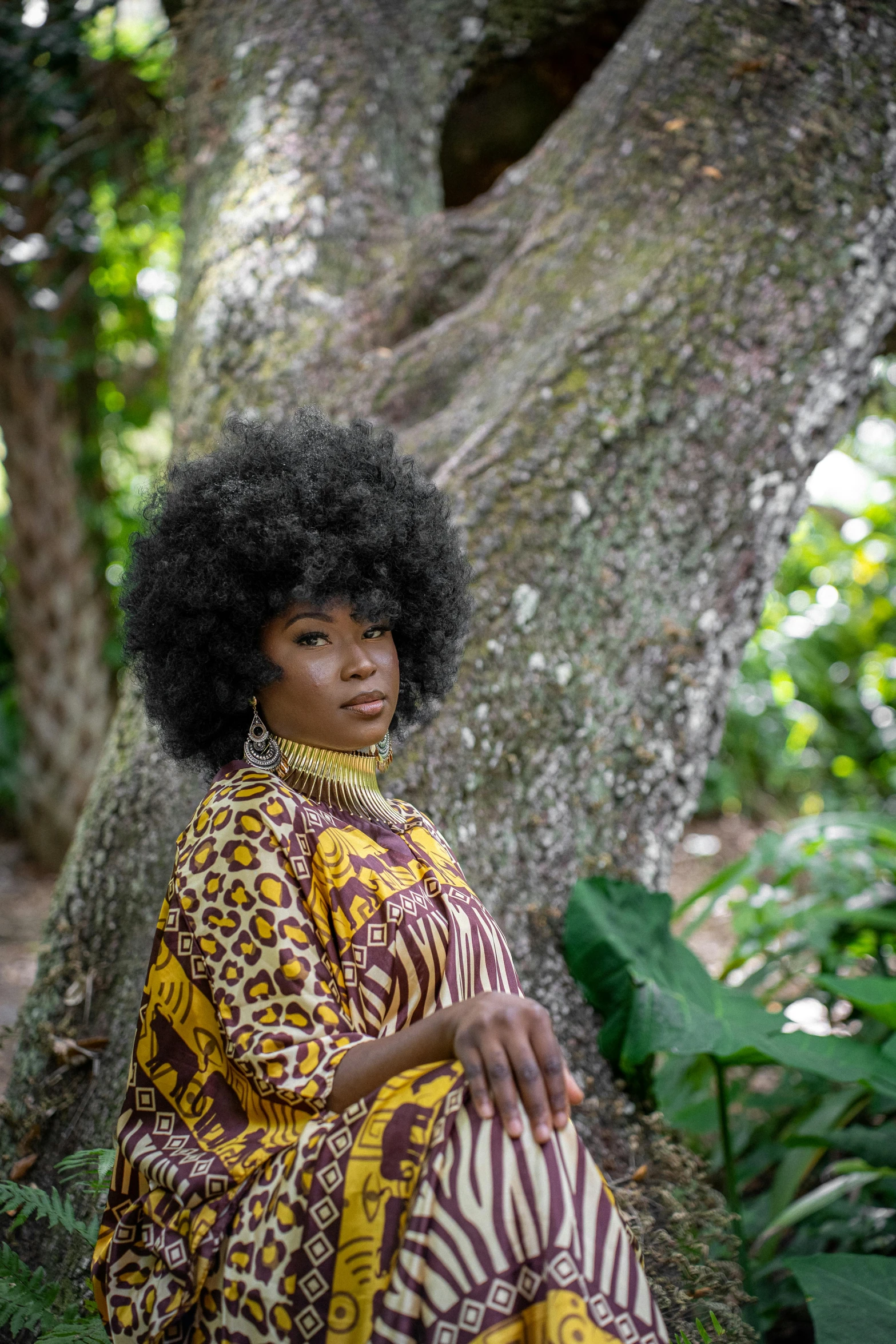 a woman with an afro in a yellow dress