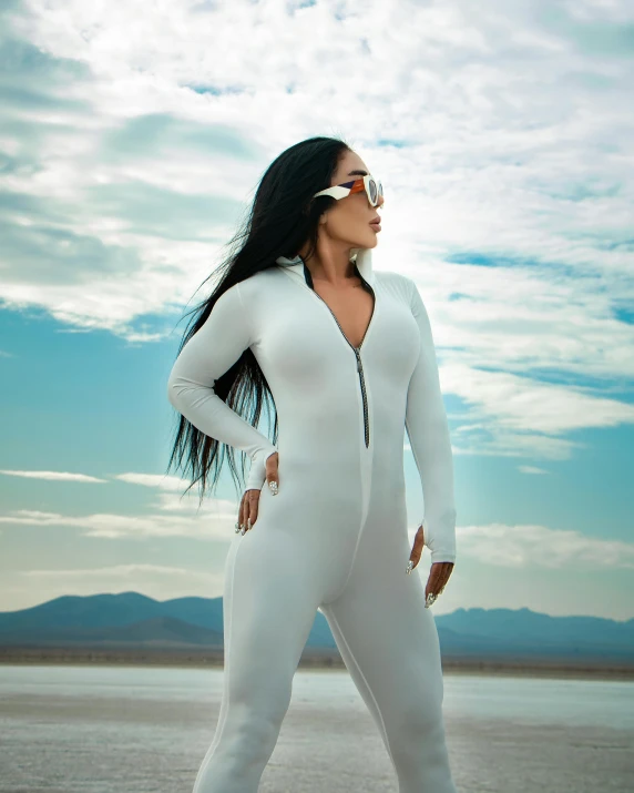 a woman with long hair and a white bodysuit