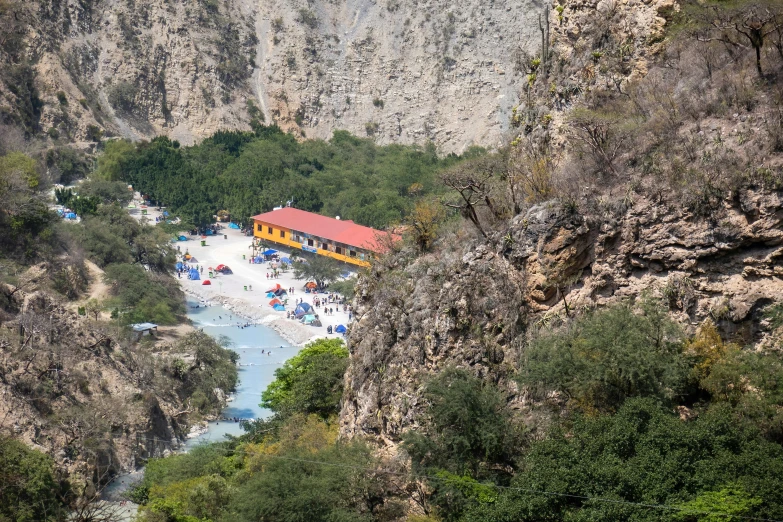 a view from above of a camping tent and river