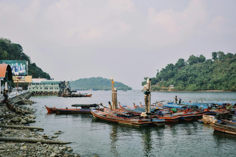 many boats docked near one another in the water