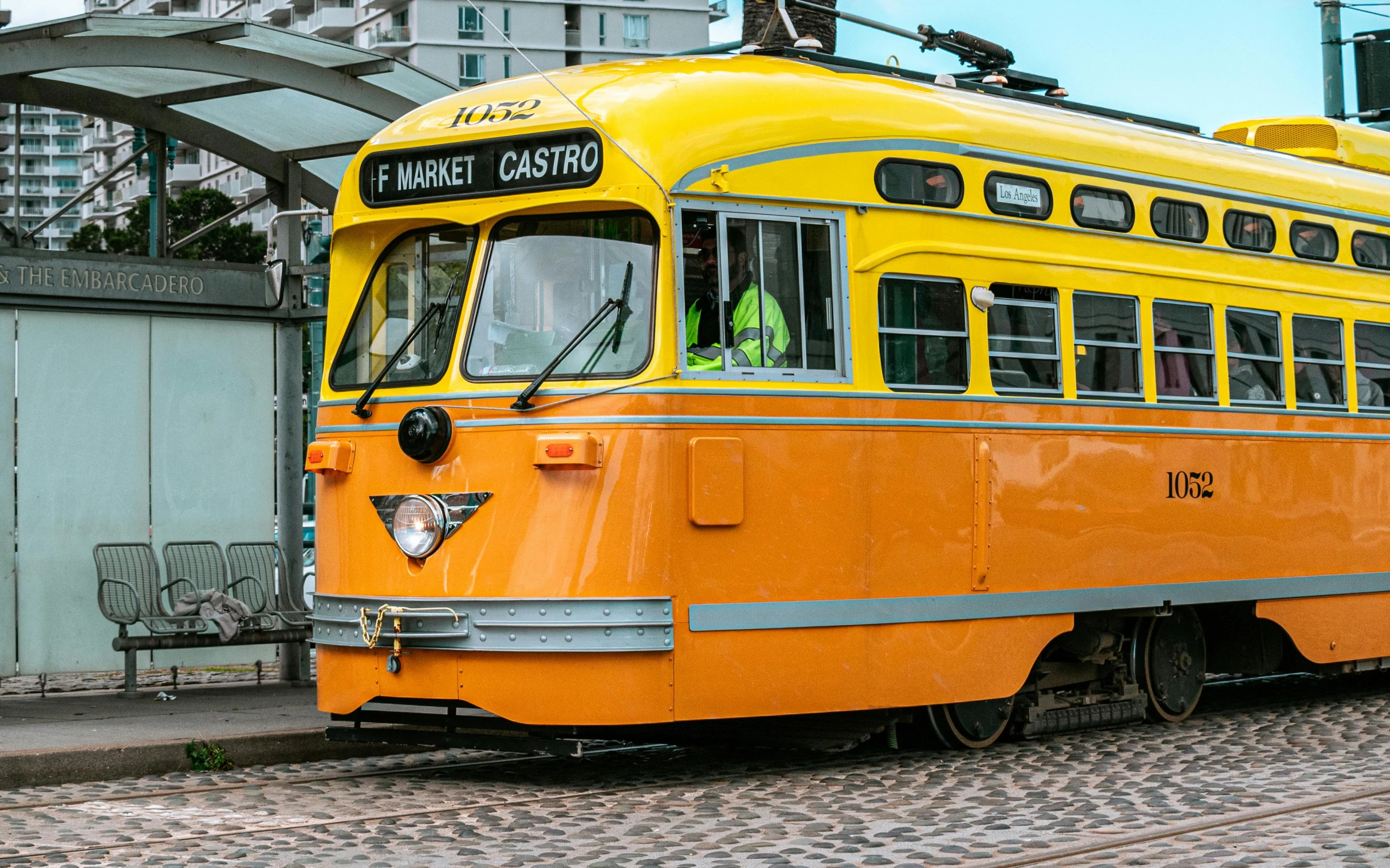 an old fashioned train sitting on the tracks