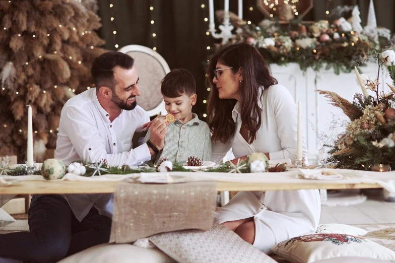 a family sitting at a table sharing christmas dinner