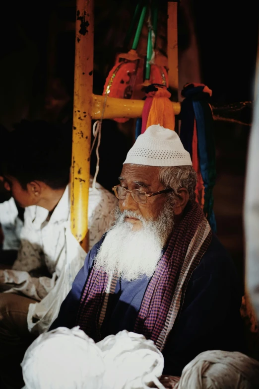 a man in a colorful outfit with a long beard