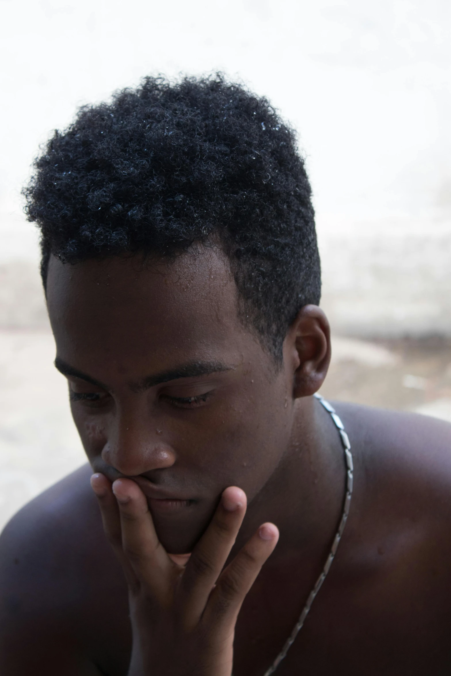 a close up of a person sitting at a table