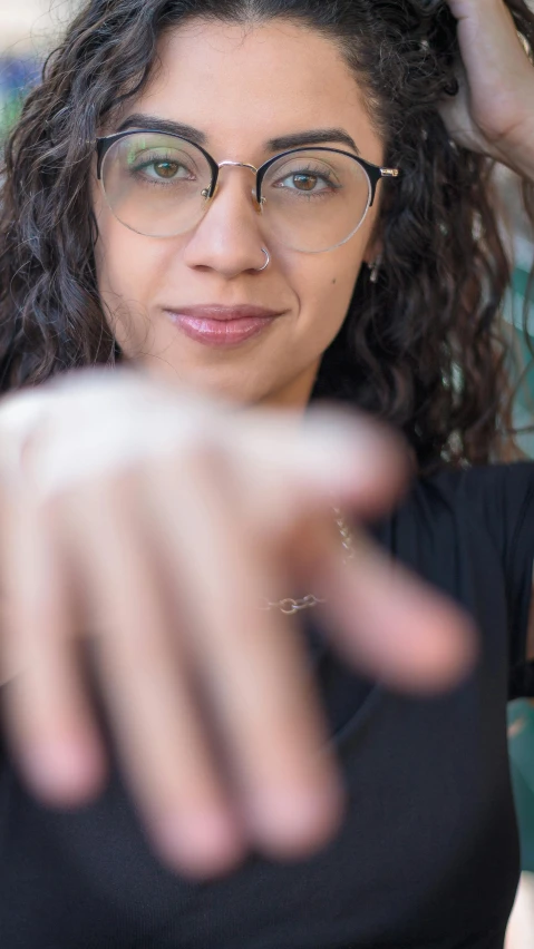 a woman is shown holding her hair up