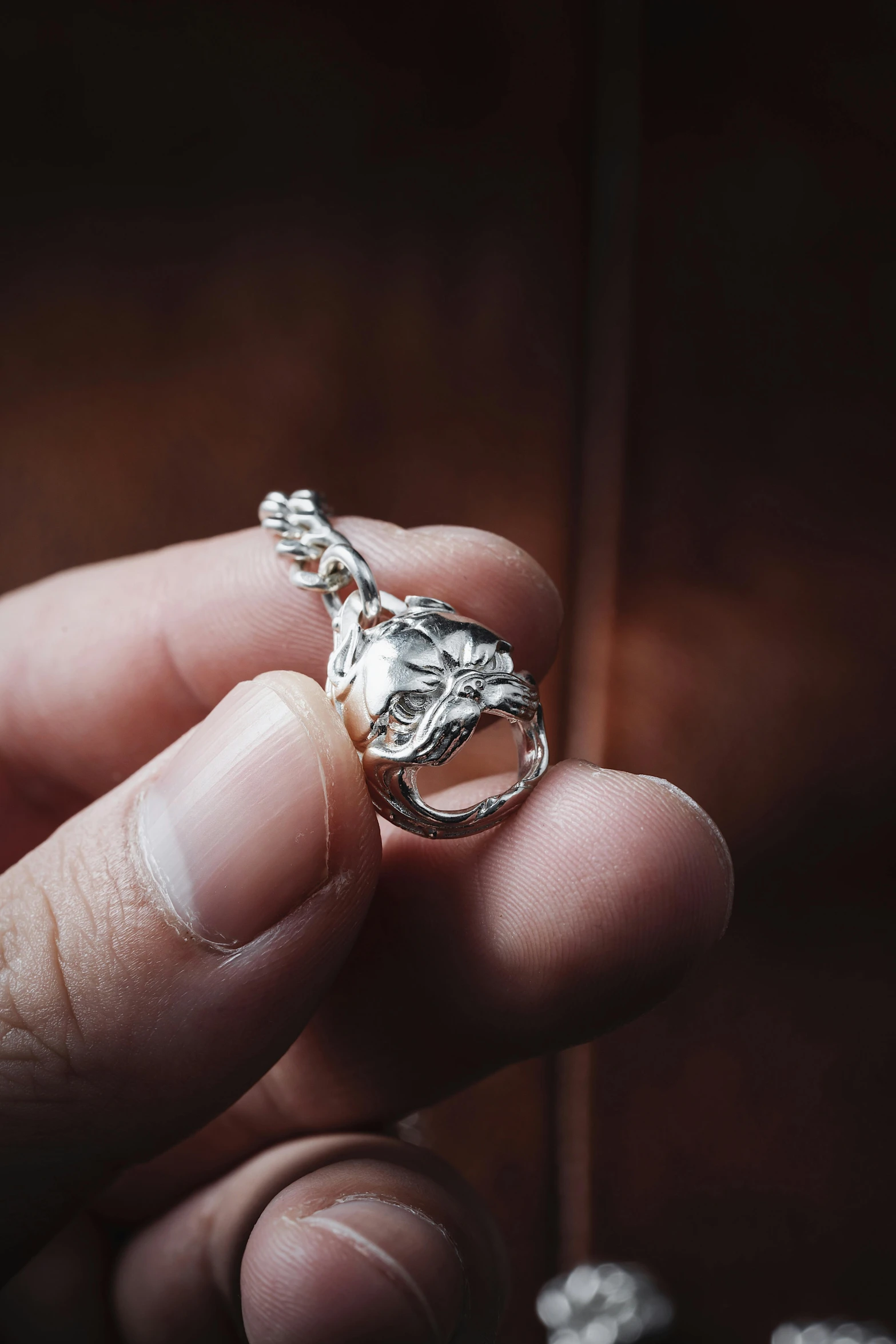 someone holding a ring that has been shaped like a fish