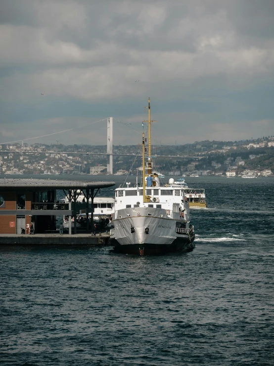 the boat is sitting on the large body of water