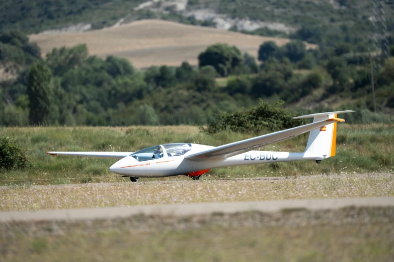 a white plane sitting on top of an airport tarmac