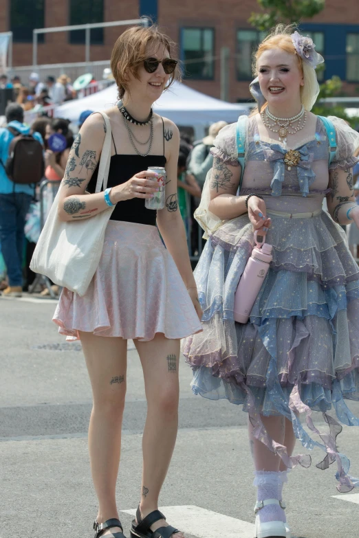 two women in short dresses on the street