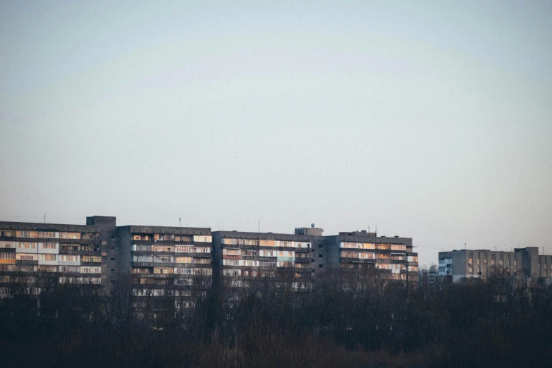 a row of buildings lit up at night