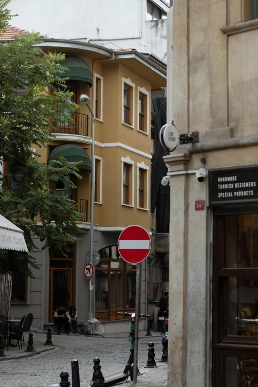 an old city intersection with a stop sign