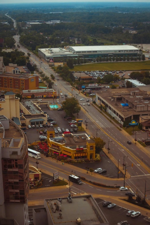 a city street with a train next to buildings