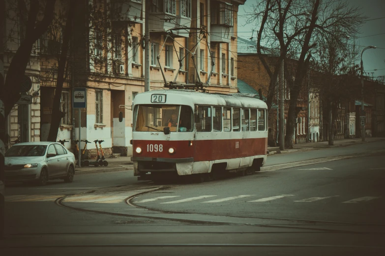 an old trolley car travels down the street