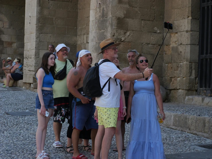 a man and many people at a historical site