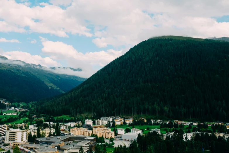 a picture looking down on mountains and the town