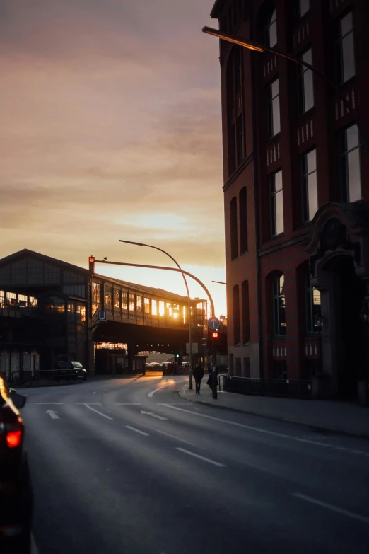 a street in an urban setting, with traffic passing