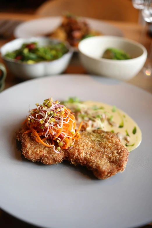 a plate topped with two pieces of fried food