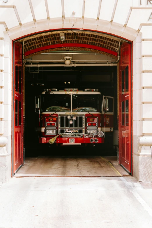 a fire engine parked inside of a garage