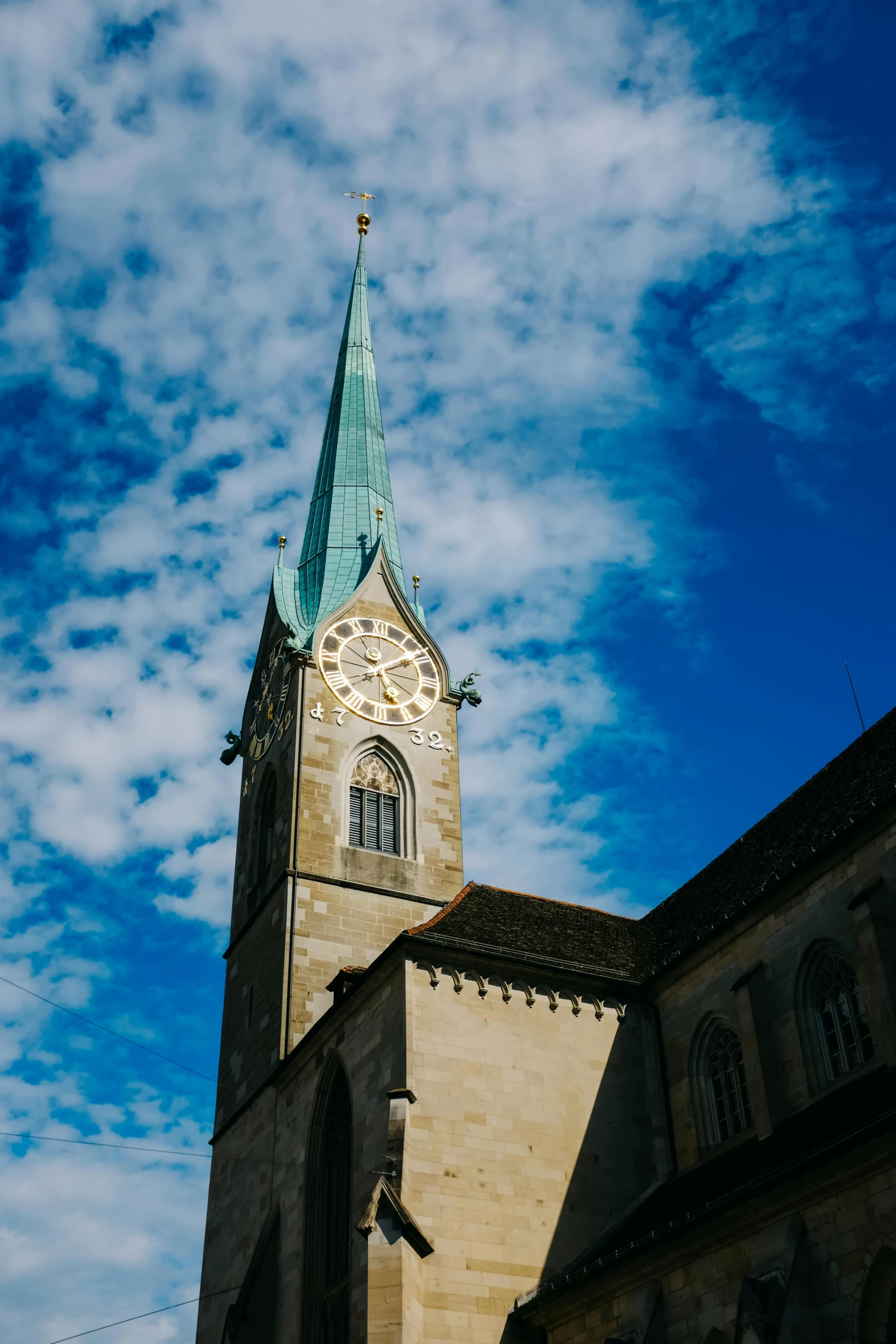 a very tall church steeple with a clock on it