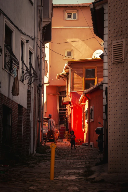 a street with people walking around and people on the other side