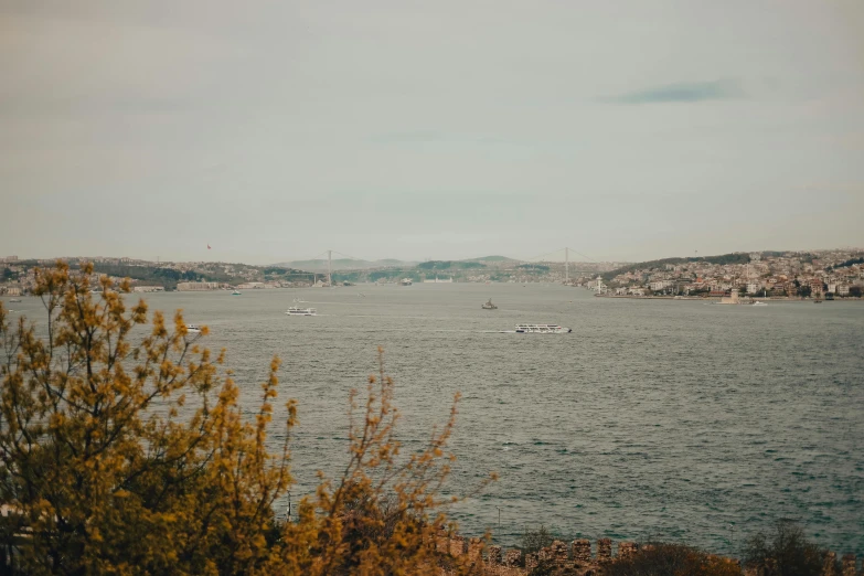 some boats in the water and one on the other side