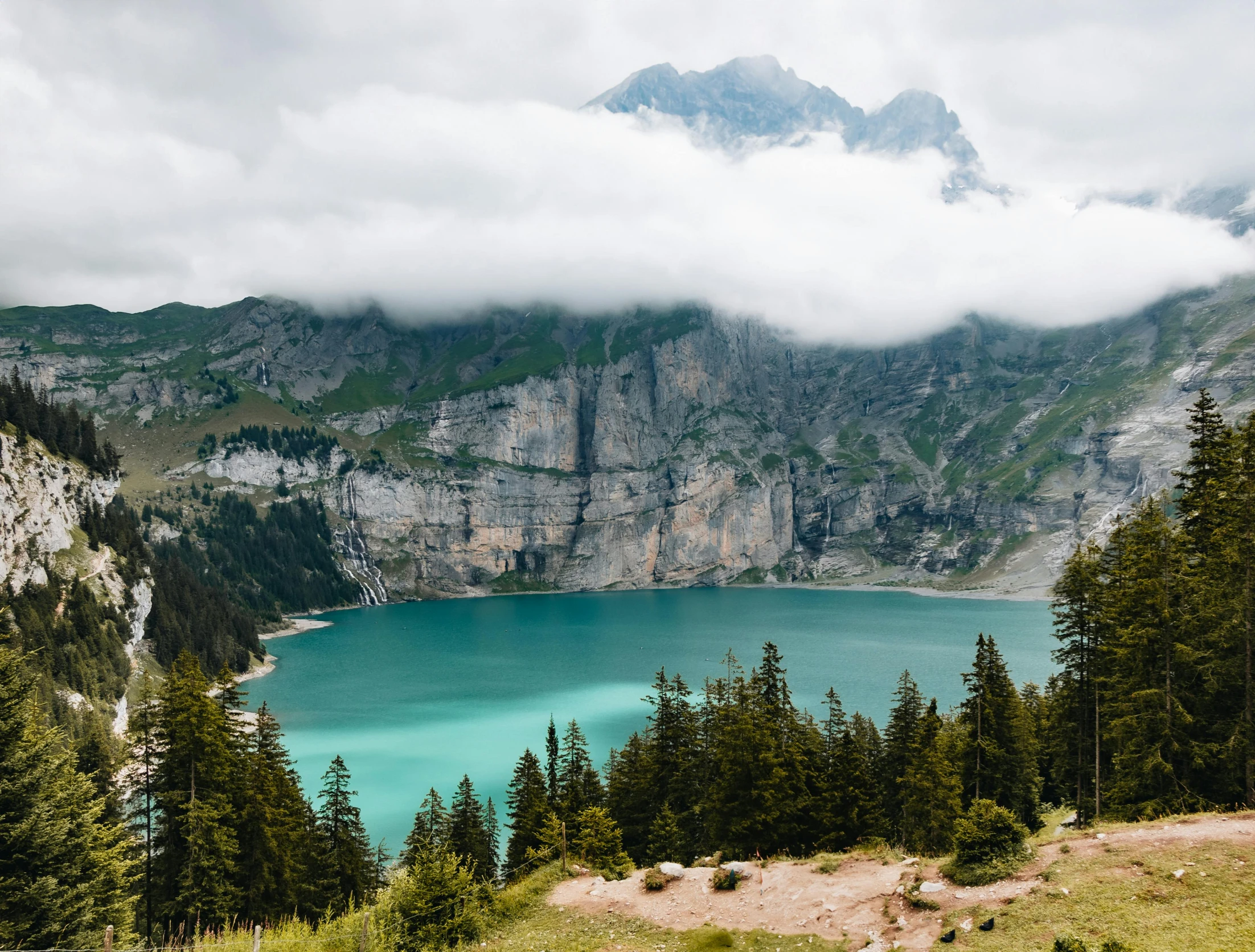 a large lake in the middle of a mountain