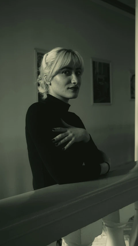 a black and white po of a woman on a stairway