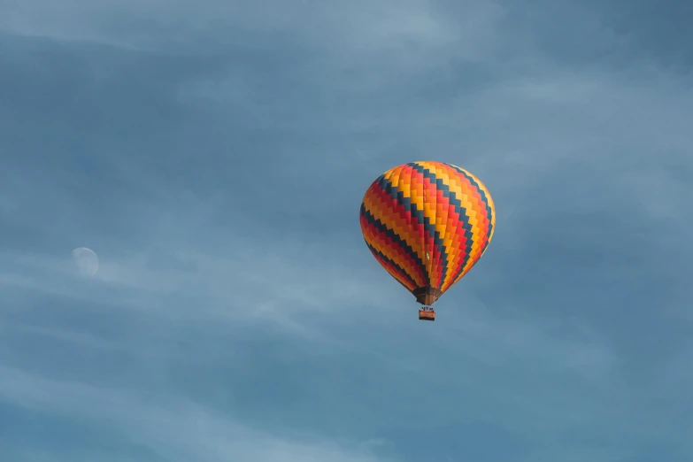 a  air balloon flying through a blue sky