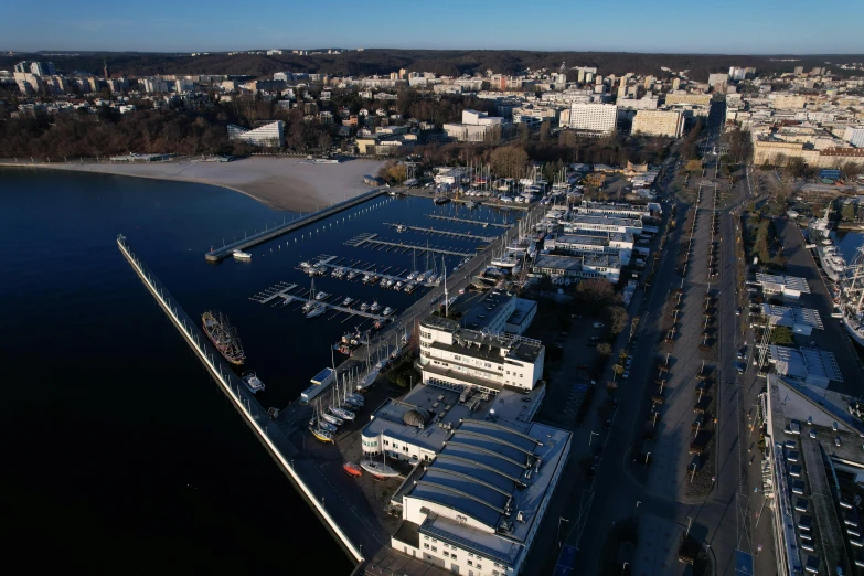 the water is filled with yachts and a city in the background