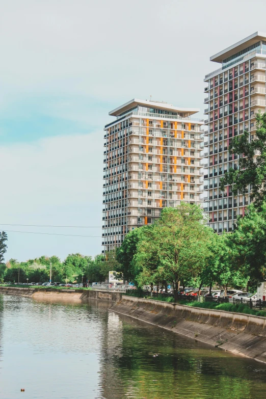 there are some very tall buildings next to the water