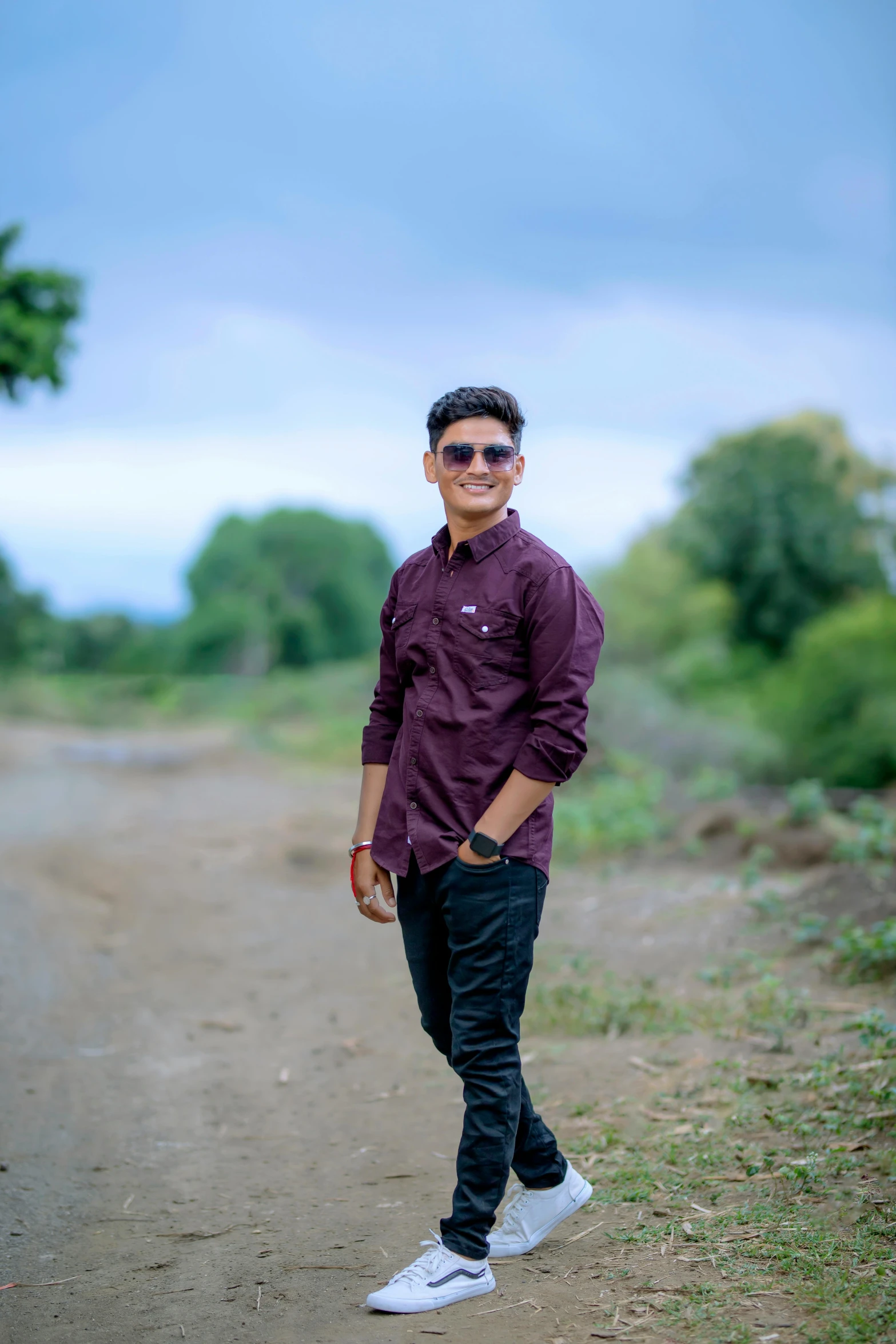 a man in sunglasses is standing on the road