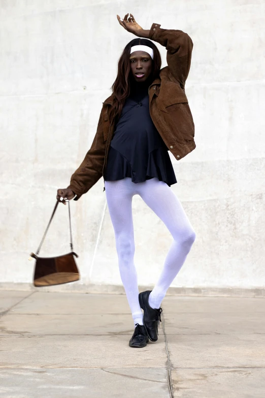 a woman with long hair and wearing white tights