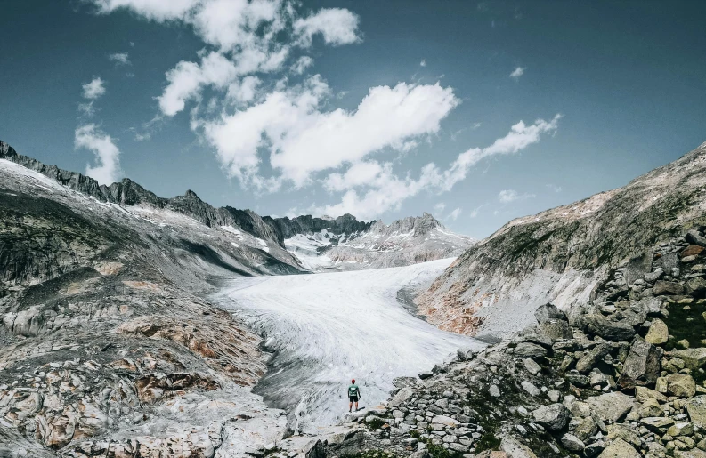 a group of people hiking through the mountain pass