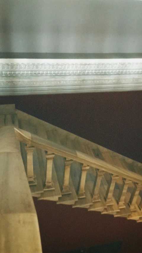 the view from below a building with an abstract pattern on the walls