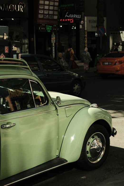 an old beetle cab parked on the street at night