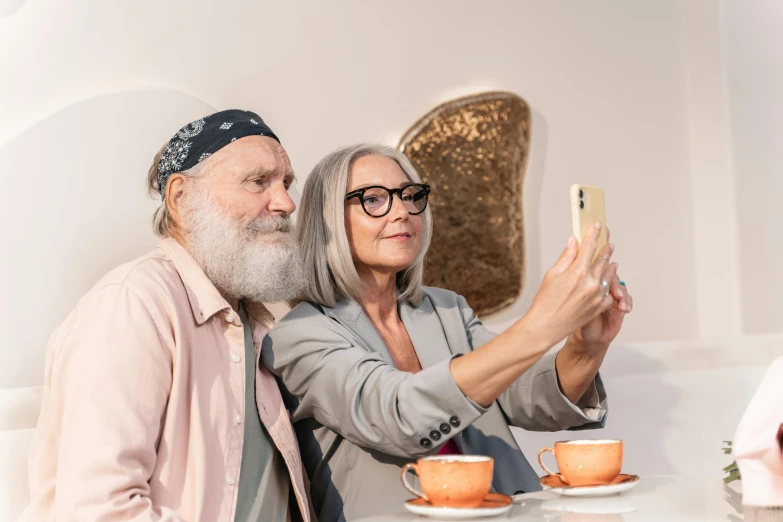 a man and woman are taking a picture