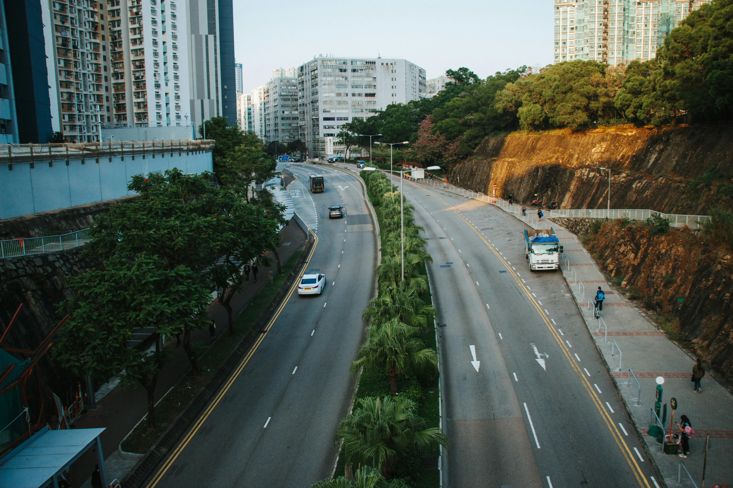 two cars are parked at the end of the highway