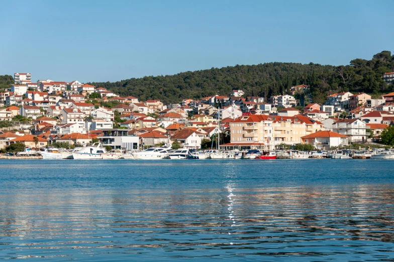 a body of water with buildings on the top