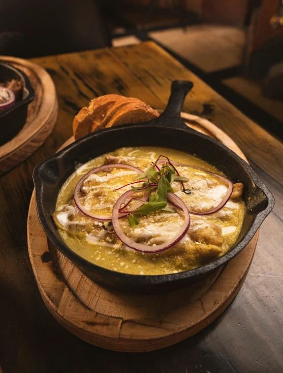 a plate that has food in it on a wooden table