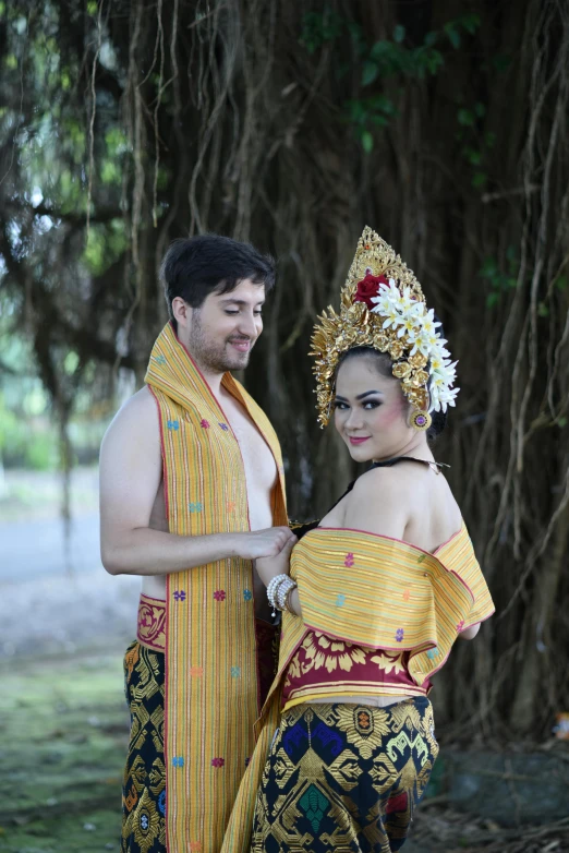 a man and woman are dressed in costumes