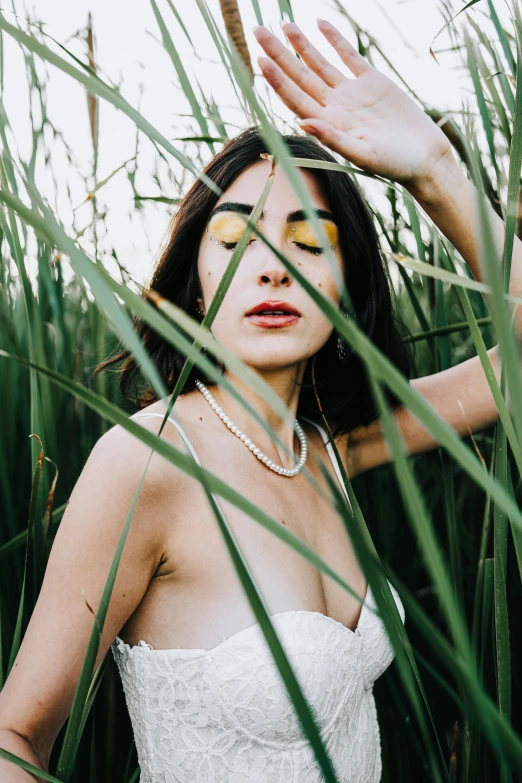 woman with make up on head in grass