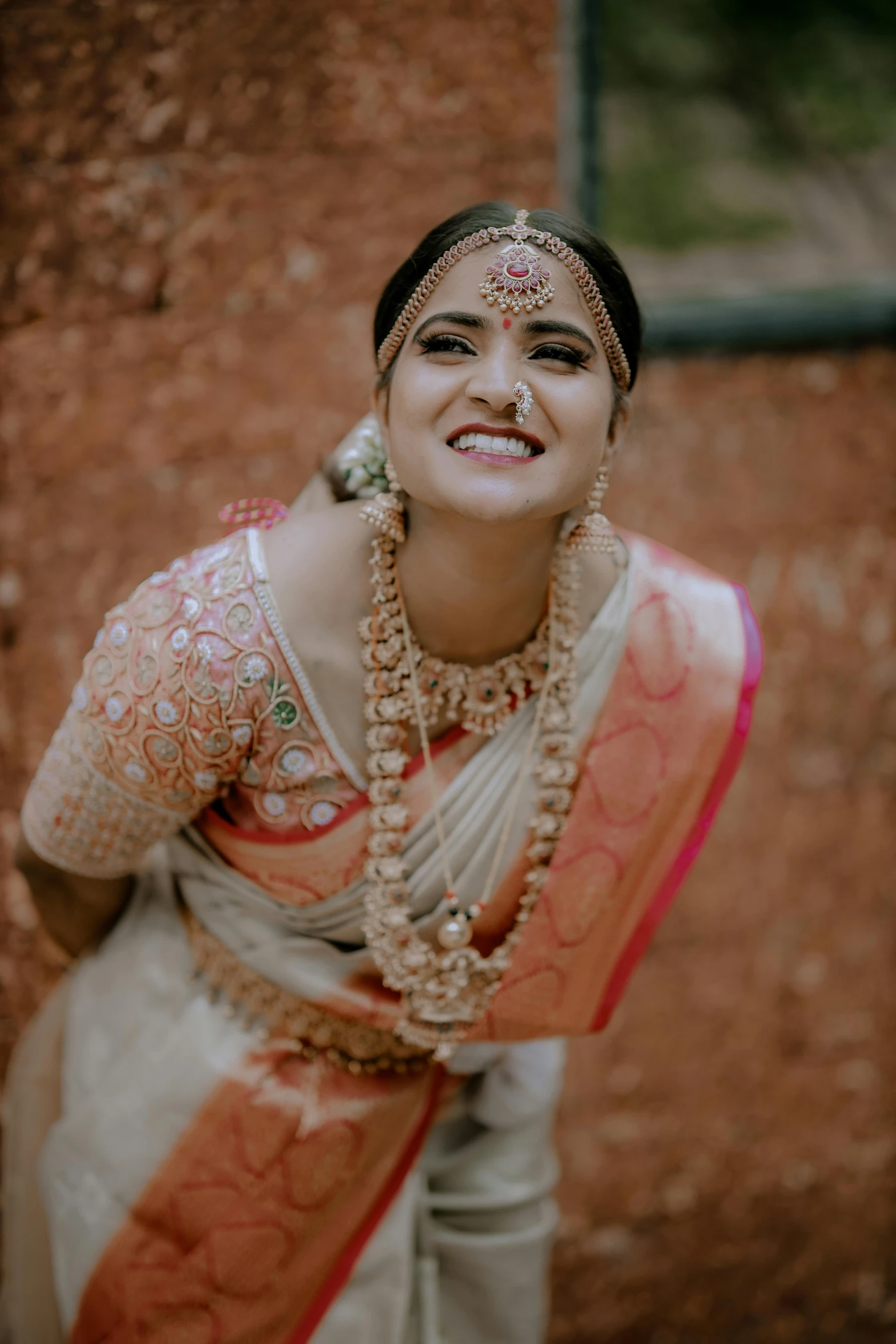 a beautiful indian woman smiling with eyeshadow