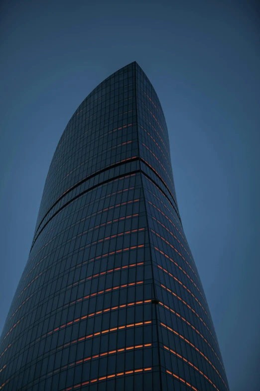 a tall black building with orange and red stripes