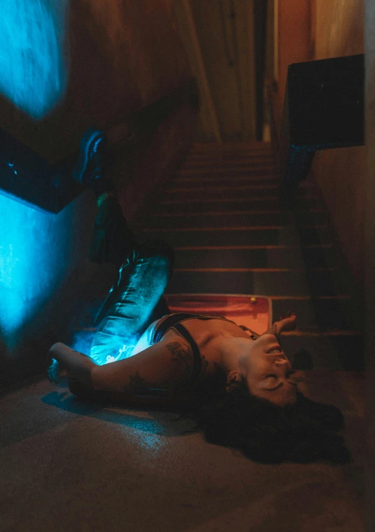 a person laying on the floor near a shoe