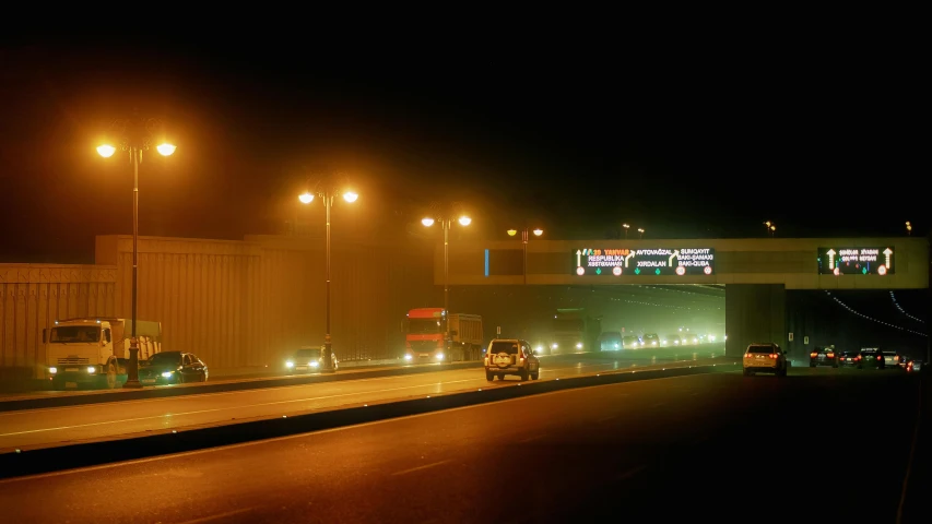 cars on a freeway near a street light