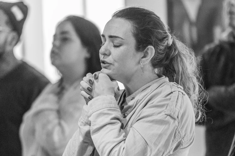 a woman is taking notes while others wait