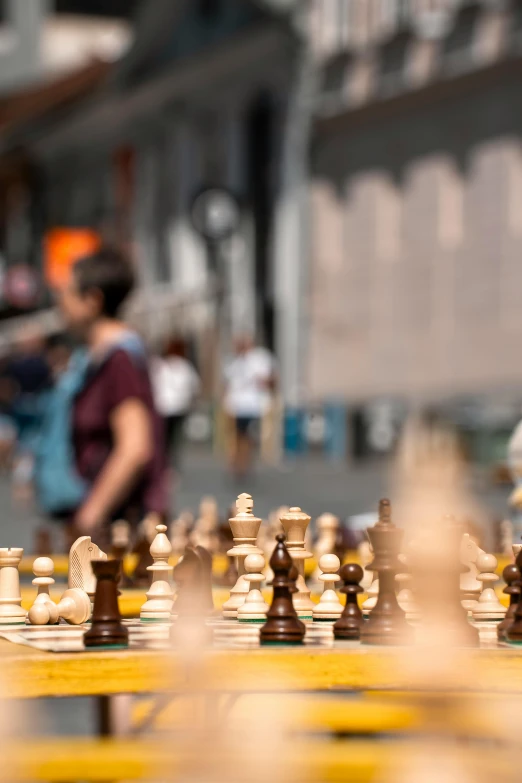 a closeup of the wooden chess set in action