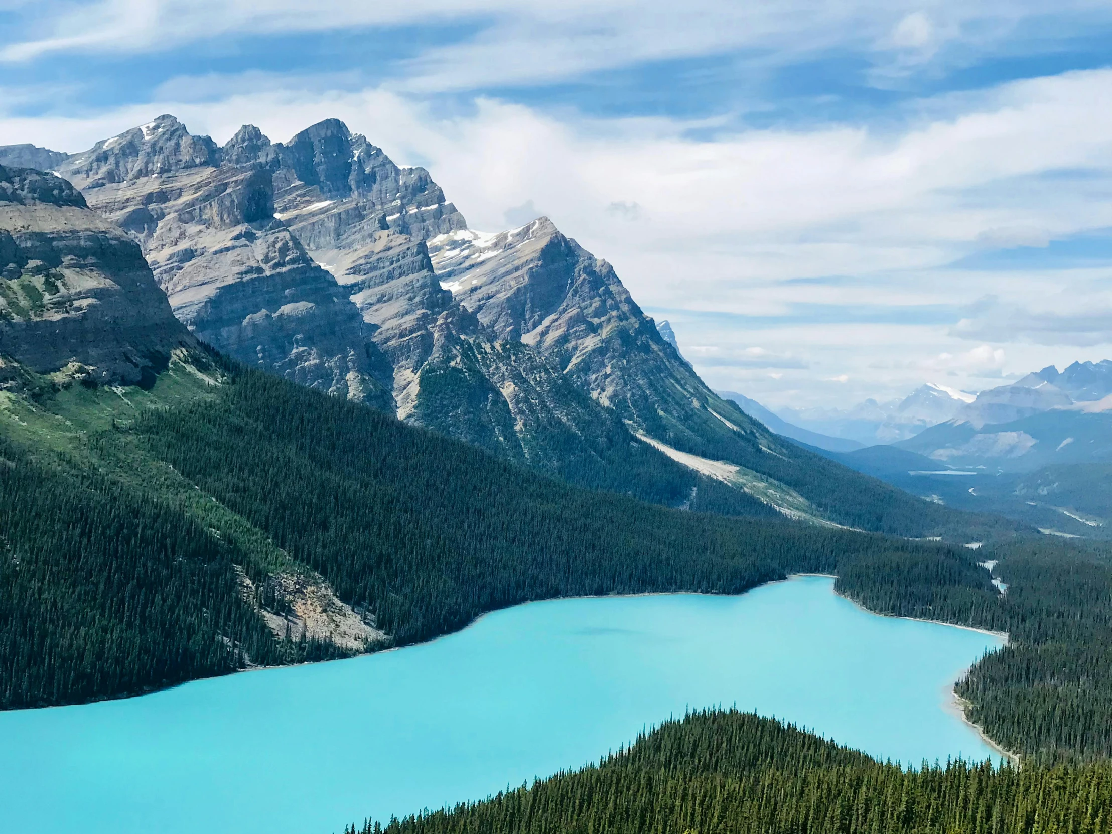 a river in the middle of a beautiful valley